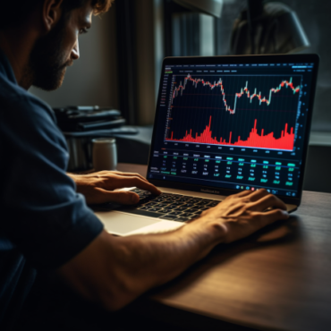 A person analyzing stock market charts and graphs on a laptop as they learn how to start dividend investing